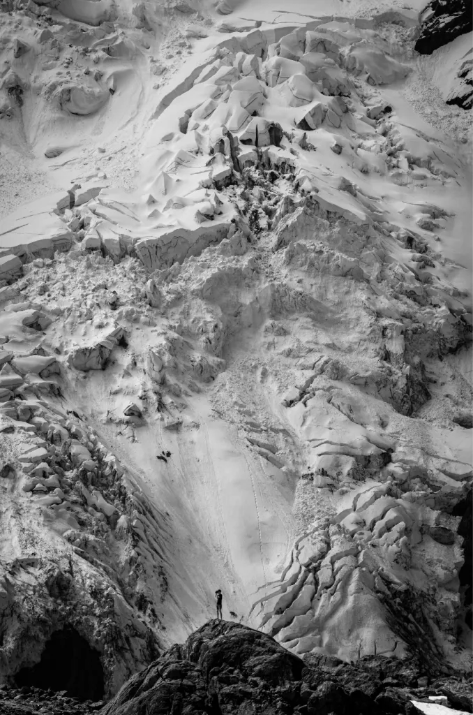 A skier with an inflated avalanche airbag
