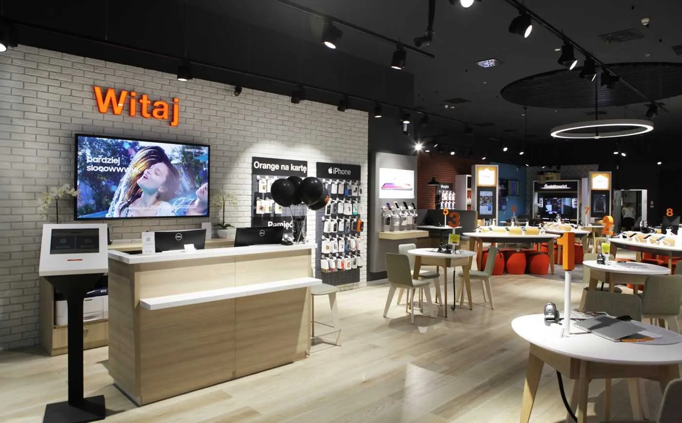 The interior of an Orange Smart Store with a reception desk